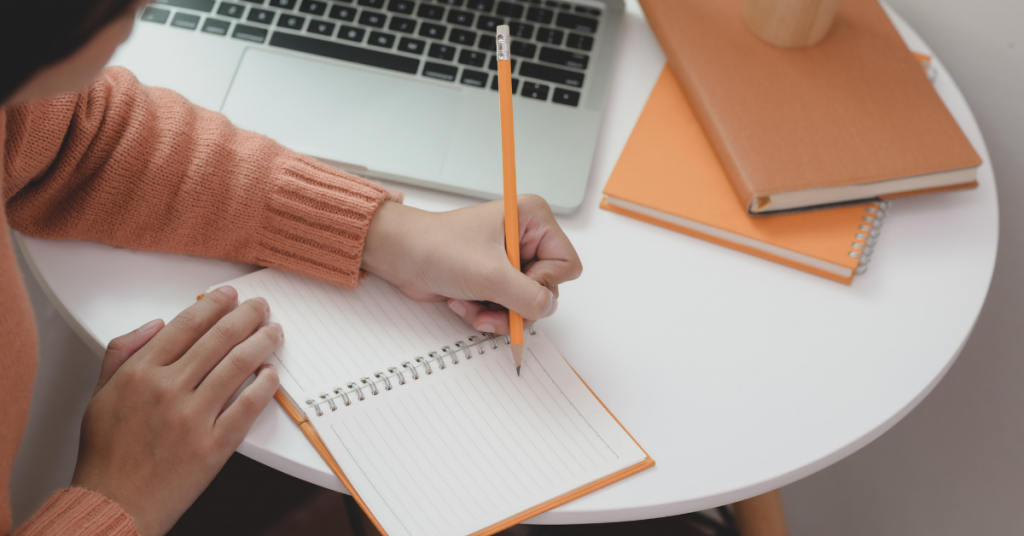 Freelance writing: A girl writing on her notebook